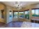 Eat-in kitchen offers pool view through windows and a door to the outdoor space and spiral staircase at 5520 E Desert Forest Trl, Cave Creek, AZ 85331