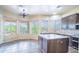 Spacious kitchen and breakfast nook with a ceiling fan and views of the desert landscape at 5520 E Desert Forest Trl, Cave Creek, AZ 85331