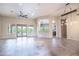 Bright and airy living room featuring tile floors, large windows, and an open layout at 5520 E Desert Forest Trl, Cave Creek, AZ 85331