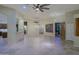 Large living room with tiled floors, ceiling fan, and easy access to other rooms at 5520 E Desert Forest Trl, Cave Creek, AZ 85331