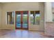 Inviting living room with tile flooring and access to outdoor pool via double doors and expansive mountain views at 5520 E Desert Forest Trl, Cave Creek, AZ 85331