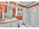 Bathroom featuring an updated vanity with framed mirror and tub with shower at 600 S Dobson Rd # 178, Mesa, AZ 85202