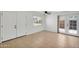 Bedroom with tiled floors, ceiling fan, backyard access, and neutral colors at 600 S Dobson Rd # 178, Mesa, AZ 85202