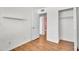 Bedroom with laminate wood floors, a ceiling fan, and a closet at 600 S Dobson Rd # 178, Mesa, AZ 85202