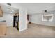 Living room with eat in kitchen, stairs and tiled floors at 600 S Dobson Rd # 178, Mesa, AZ 85202