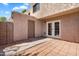 Private outdoor patio featuring block wall, tile pavers, and access door at 600 S Dobson Rd # 178, Mesa, AZ 85202
