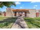 Community pool area with gated access, lush landscaping, and mature trees at 600 S Dobson Rd # 178, Mesa, AZ 85202