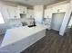 Bright kitchen featuring white cabinetry, a large island, and modern fixtures at 6262 S Dean Rd, Buckeye, AZ 85326