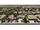 An elevated view showcases a neighborhood featuring homes with solar panels at 651 W Cobblestone Dr, Casa Grande, AZ 85122