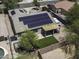 This elevated perspective highlights solar panels, backyard green space, covered patio and privacy fence at 651 W Cobblestone Dr, Casa Grande, AZ 85122