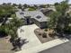 Bird's eye view of a single-story home with solar panels and a circular driveway at 651 W Cobblestone Dr, Casa Grande, AZ 85122