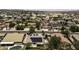 Aerial view shows neighborhood homes with solar panels at 651 W Cobblestone Dr, Casa Grande, AZ 85122