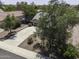 An elevated view reveals home with large circular driveway and desert landscaping at 651 W Cobblestone Dr, Casa Grande, AZ 85122
