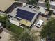 Aerial view showing solar panels, green backyard, and covered patio at 651 W Cobblestone Dr, Casa Grande, AZ 85122