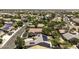 An aerial neighborhood view of homes with solar panels at 651 W Cobblestone Dr, Casa Grande, AZ 85122