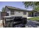 Backyard featuring solar panels, a hot tub, and a patio at 651 W Cobblestone Dr, Casa Grande, AZ 85122