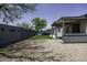 Backyard featuring covered patio, block wall, artificial turf and gravel area at 651 W Cobblestone Dr, Casa Grande, AZ 85122