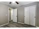 Bedroom with wood-look floors, closet and ceiling fan at 651 W Cobblestone Dr, Casa Grande, AZ 85122