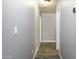 Hallway with wood-look floors and neutral paint at 651 W Cobblestone Dr, Casa Grande, AZ 85122