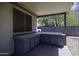 Covered outdoor kitchen with cabinets and tile countertops, perfect for entertaining at 651 W Cobblestone Dr, Casa Grande, AZ 85122