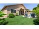 Well-maintained backyard with artificial grass, a shed, lounge seating, and mountain views at 6787 W Saddlehorn Rd, Peoria, AZ 85383