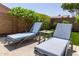 Lounge in style with comfortable seating in a perfectly arranged and landscaped backyard at 6787 W Saddlehorn Rd, Peoria, AZ 85383