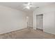Bedroom with carpet, ceiling fan, and closet providing comfort and convenience at 6787 W Saddlehorn Rd, Peoria, AZ 85383