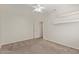 Bedroom featuring soft carpet, ceiling fan, and closet, perfect for rest and relaxation at 6787 W Saddlehorn Rd, Peoria, AZ 85383