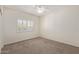 Bright bedroom with plush carpet and plantation shutters, creating a cozy and inviting space at 6787 W Saddlehorn Rd, Peoria, AZ 85383