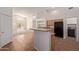 Open kitchen with black appliances and bar counter, perfect for casual dining and entertaining at 6787 W Saddlehorn Rd, Peoria, AZ 85383