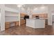 Spacious kitchen and study nook with ample cabinet space offer both functionality and convenience at 6787 W Saddlehorn Rd, Peoria, AZ 85383