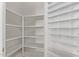Large pantry offers plenty of space for food storage and organization solutions in the kitchen at 6787 W Saddlehorn Rd, Peoria, AZ 85383