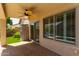 Covered patio area with a ceiling fan, seamlessly blending indoor and outdoor living spaces at 6787 W Saddlehorn Rd, Peoria, AZ 85383