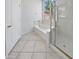 Bright bathroom with a soaking tub, separate shower, and a large window overlooking the garden at 7316 E Fledgling Dr, Scottsdale, AZ 85255