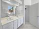 Bright bathroom with double sinks, a large mirror, and a separate shower at 7316 E Fledgling Dr, Scottsdale, AZ 85255