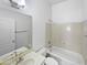 Well-lit bathroom featuring a vanity sink, tub, and white walls at 7316 E Fledgling Dr, Scottsdale, AZ 85255