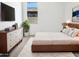 Cozy bedroom with modern furniture and a large window offering natural light at 7316 E Fledgling Dr, Scottsdale, AZ 85255