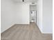 Neutral carpet and white walls in a bedroom with open door, offering a simple and clean space at 7316 E Fledgling Dr, Scottsdale, AZ 85255