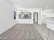 Spacious living area with neutral carpet and an open layout to the kitchen at 7316 E Fledgling Dr, Scottsdale, AZ 85255