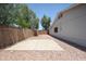 View of the backyard featuring a concrete slab, a privacy fence, and minimal landscaping at 759 W Los Lagos Vista Ave, Mesa, AZ 85210