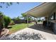 Large backyard features a covered patio, grassy area, and gardening space at 759 W Los Lagos Vista Ave, Mesa, AZ 85210