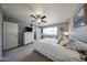 Bedroom featuring plush carpeting, natural light, and a spacious closet, creating a cozy retreat at 759 W Los Lagos Vista Ave, Mesa, AZ 85210