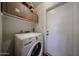 A bright laundry area with modern appliances and practical storage solutions at 759 W Los Lagos Vista Ave, Mesa, AZ 85210