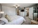 Cozy main bedroom boasts a ceiling fan, closet, and ensuite bathroom access at 759 W Los Lagos Vista Ave, Mesa, AZ 85210