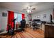 Spacious office with wood floors, natural light, and a ceiling fan at 759 W Los Lagos Vista Ave, Mesa, AZ 85210