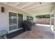 The covered patio includes a grill and bar seating for entertaining outdoors at 759 W Los Lagos Vista Ave, Mesa, AZ 85210