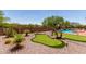 Fun backyard with a putting green, bridge, and a pool, perfect for outdoor activities and relaxation at 7762 E Russell Cir, Mesa, AZ 85207