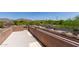 Desert landscape as seen from a private balcony. Features include a view of green trees and asphalt at 7762 E Russell Cir, Mesa, AZ 85207