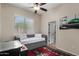 Comfortable bedroom with a neutral palette, lots of light, and a ceiling fan at 7762 E Russell Cir, Mesa, AZ 85207