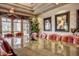 Modern conference room featuring a large table, leather chairs, and natural light at 7762 E Russell Cir, Mesa, AZ 85207